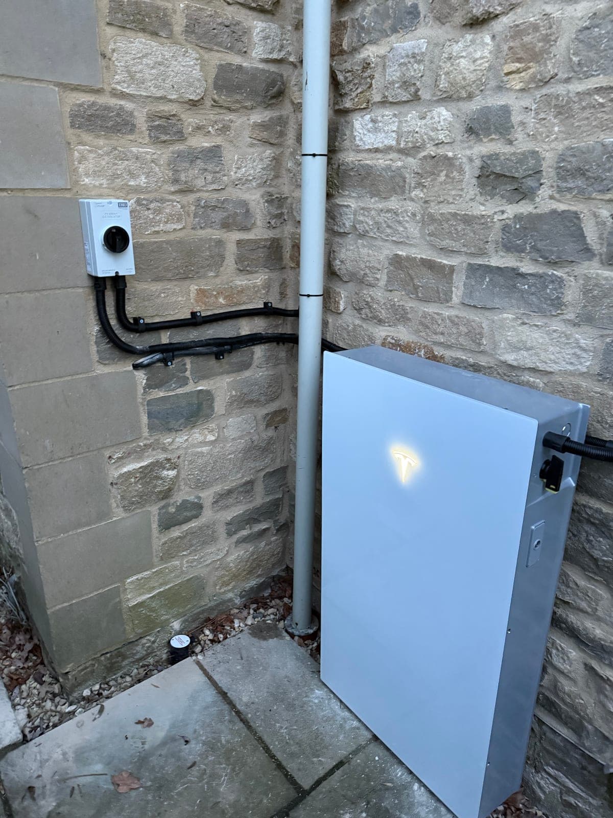 Inverter cabinet on a stone-clad rural property