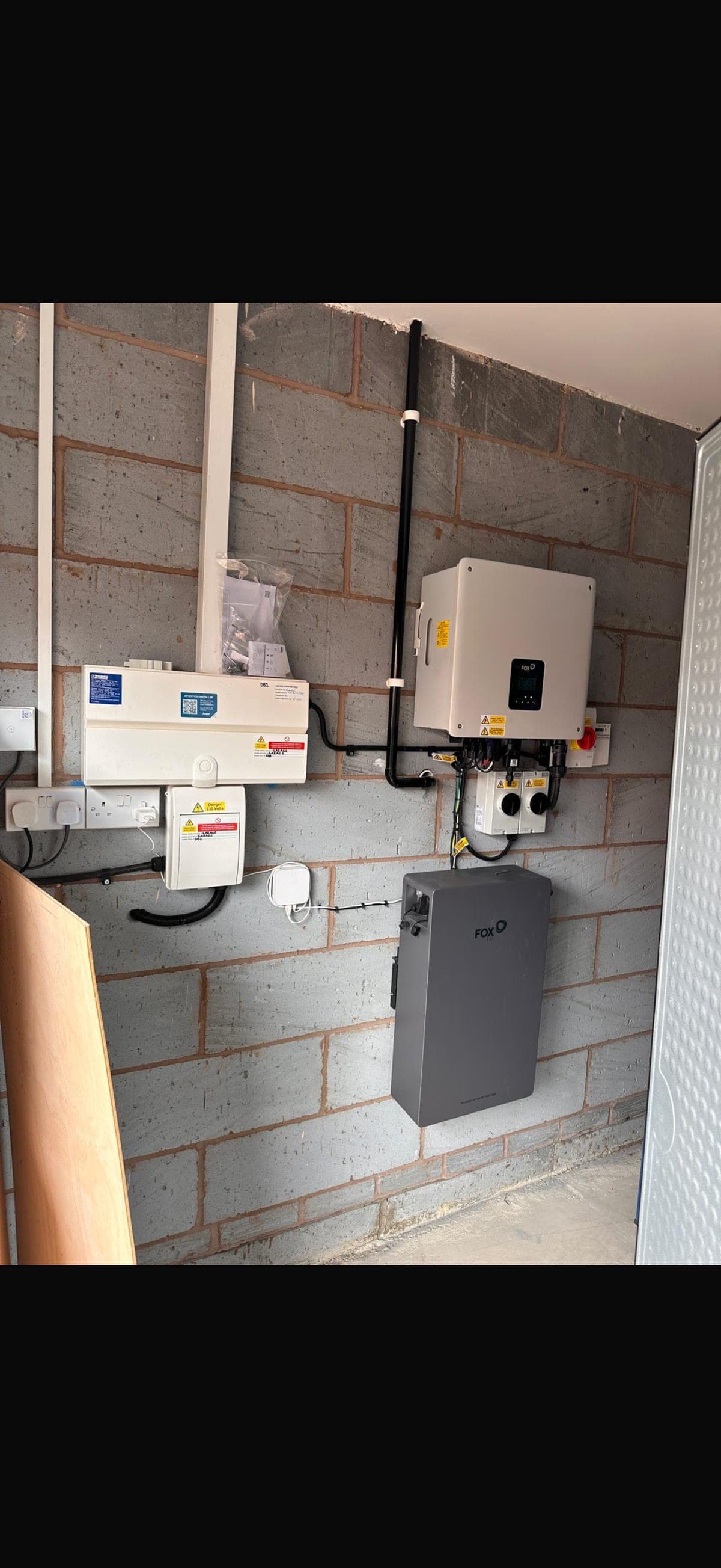 Fox battery and inverter neatly installed in a garage utility