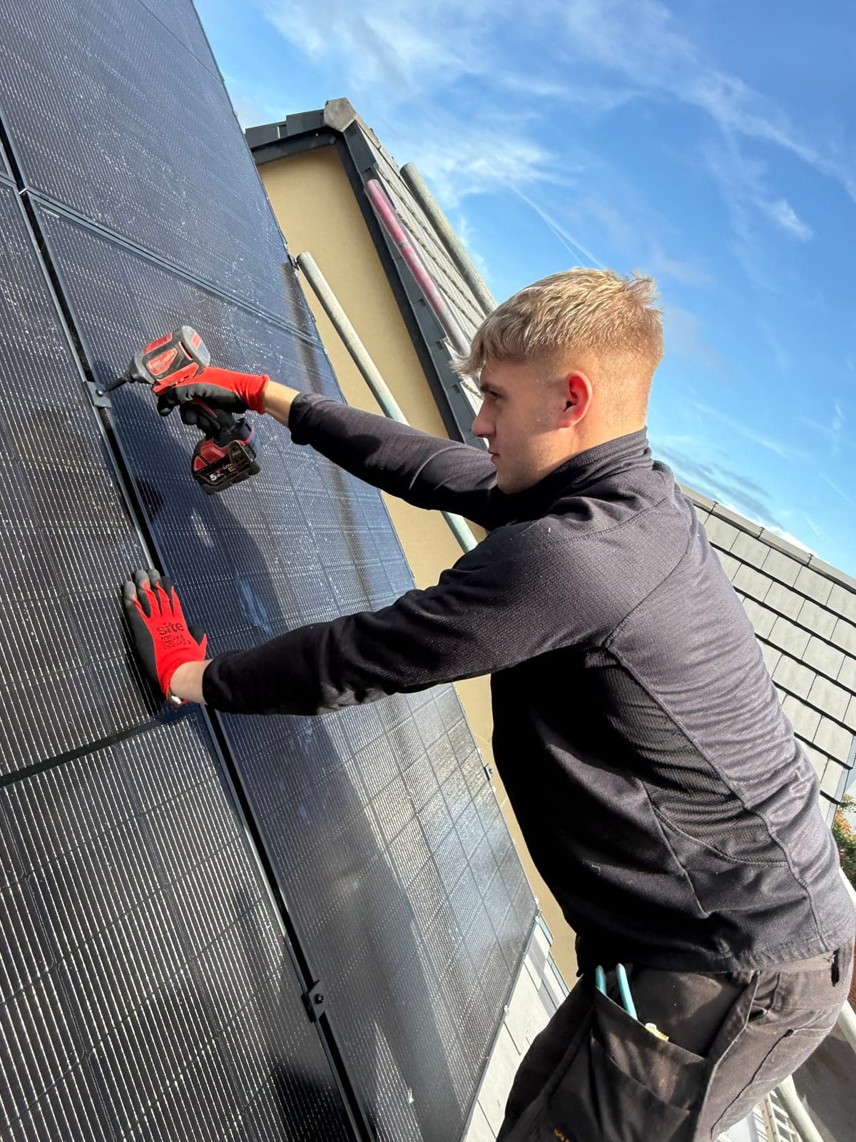 Djuka engineer fixing solar panels in place