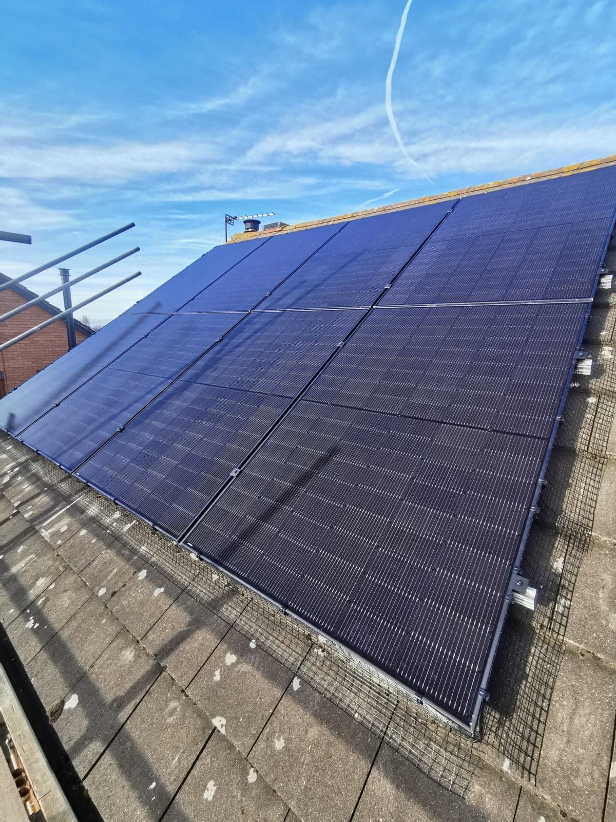 Wide rooftop view of a finished solar array